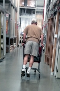 Tech support riding the cart while shopping. They never grow up really.