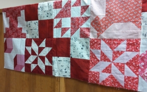 What's hanging over the other side. Can you find my blocks? This one will go to safe house when quilted by someone else.