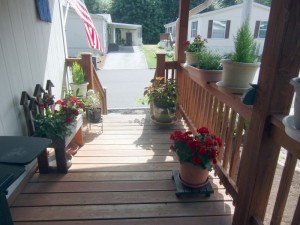 Filling front porch with flowers out of the heat