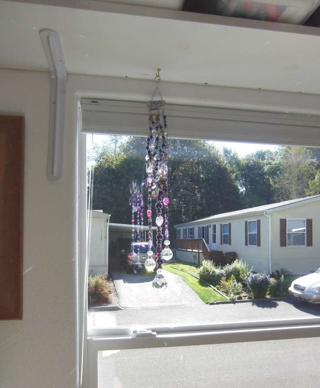 This is the larger purple dangler that hangs in my sewing room to inspire me. So much prettier with clean windows. 